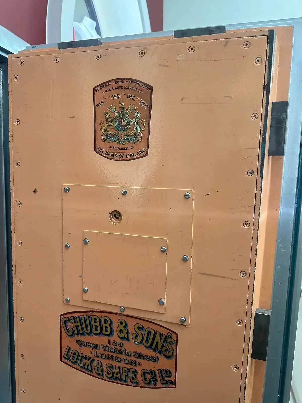 The inside face of an old Chubb & Son's vault door, with its "By Special Royal Appointment" and Chubb & Son's London transfers